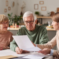 attorney discussing power of attorney to an elder couple