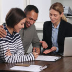 Couple Consulting With Professional Notary In Office